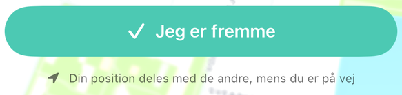 Knappen "Jeg er fremme" med linjen "Din position deles med de andre, mens du er på vej" under.